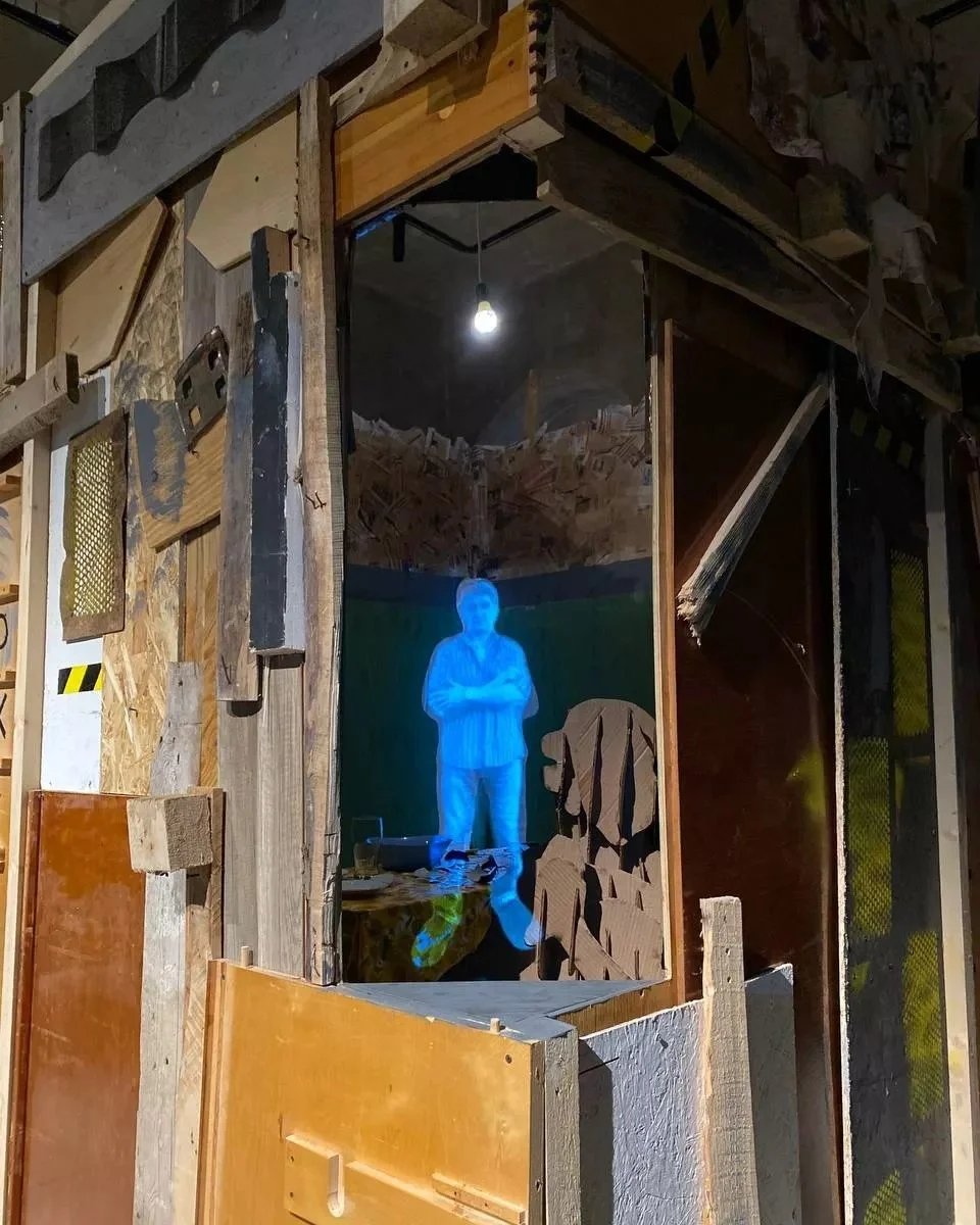 Projected figure inside the hut