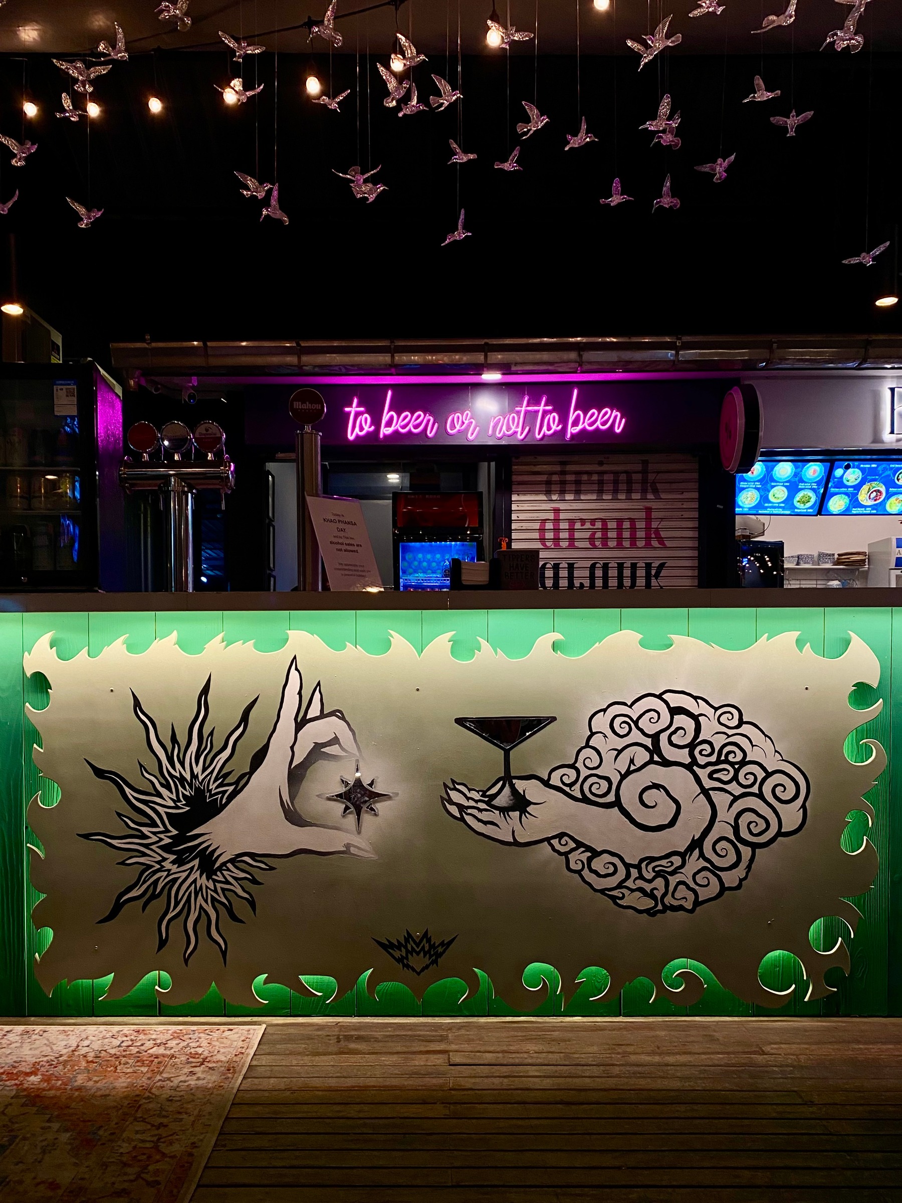 Primordial Exchange: a painted bar counter panel with mirror and LED strip