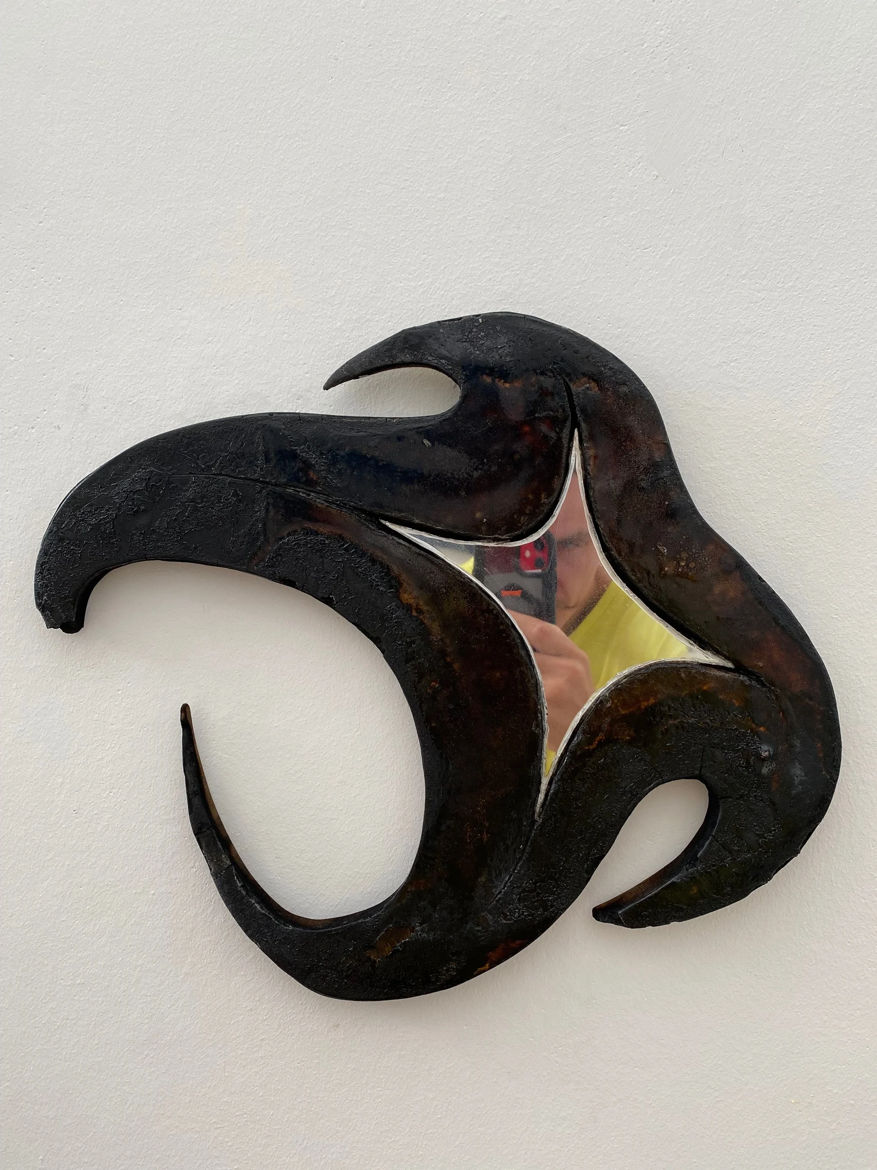 Shine, Shine, My Little Star: a charred wooden star with a mirror centre
