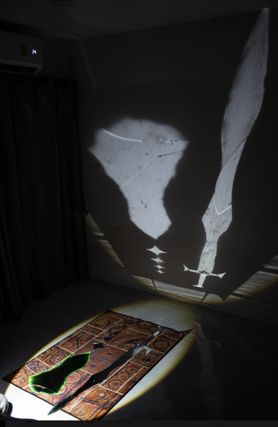 Reflected sword and shield on the wall, mirror cut-outs on a rug