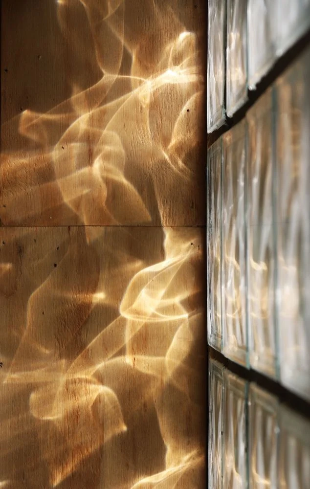 Caustic light patterns on a wall